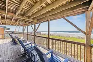 5127 W Beach Drive, Oak Island, NC 28465 — 5-bedroom waterfront home, Oak Island, NC, photo 3 of 73: 50_deck