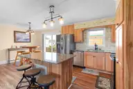 221 Bayview Drive, Harkers Island, NC 28531 — 2-bedroom waterfront home in Earl Davis, Harkers Island, NC, photo 14 of 53: Kitchen with Granite Countertops