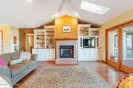 1461 S Shore Drive, Southport, NC 28461 — 3-bedroom waterfront home, Southport, NC, photo 11 of 75: Fire Place Living Room