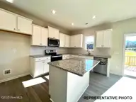 409 Springtooth Drive, Zebulon, NC 27597 — 3-bedroom home in Harvest Meadows, Zebulon, NC, photo 3 of 7: Representative Photo