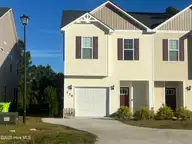 256 Currituck Drive, Holly Ridge, NC 28445 — 3-bedroom townhome in The Landing At Folkstone, Holly Ridge, NC, photo 1 of 22