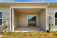 229 Cline Way Unit 104, Beaufort, NC 28516 — 3-bedroom townhome in 1809 Live Oak, Beaufort, NC, photo 24 of 44: Covered Patio and Backyard