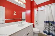 100 9th Street, Emerald Isle, NC 28594 — 6-bedroom waterfront home in Emerald Isle By The Sea, Emerald Isle, NC, photo 18 of 64: 1st floor bath