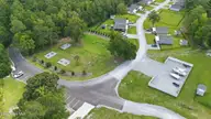 165 Long Pond Loop, Swansboro, NC 28584 — 2-bedroom waterfront condo in Cabins at Old Horse, Swansboro, NC, photo 20 of 25: Guest Parking, Comm Garden, Boat RV stor