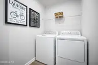 8048 Sterling Oak Drive NW, Ash, NC 28420 — 4-bedroom home in Sterling Oaks, Ash, NC, photo 11 of 16: Laundry
