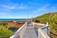 217 Salter Path Road, Pine Knoll Shores, NC 28512 — 4-bedroom waterfront home in Pine Knoll Association, Pine Knoll Shores, NC, photo 12 of 62: Walkway to Beach with Sitting Area