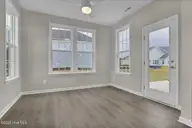 3319 Grand Park Way, Leland, NC 28451 — 5-bedroom home in Grand Park, Leland, NC, photo 18 of 47: Sunroom