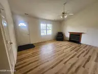 243 Parnell Road, Hubert, NC 28539 — 3-bedroom home in Foxtrace, Hubert, NC, photo 6 of 26: Wood Burning Fireplace