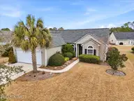 501 Sandpiper Bay Drive SW, Sunset Beach, NC 28468 — 3-bedroom home in Sandpiper Bay, Sunset Beach, NC, photo 1 of 61: Front of house