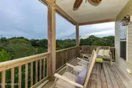 118 Shell Drive West, Emerald Isle, NC 28594 — 5-bedroom waterfront townhome, Emerald Isle, NC, photo 11 of 42: 118 Shell Dr.Main level balcony