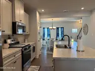 202 Winborne Loop, Elizabeth City, NC 27909 — 3-bedroom home in Pelican Pointe, Elizabeth City, NC, photo 5 of 14: wb kitchen