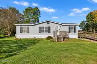 319 Honey Hill Drive, Hallsboro, NC 28442 — 3-bedroom manufactured home, Hallsboro, NC, photo 1 of 34: Sunny Manufactured Home with Lush Lawn