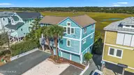 648 Ocean Boulevard W, Holden Beach, NC 28462 — 3-bedroom waterfront home in Bacon Island Harbor, Holden Beach, NC, photo 2 of 65: mls-DJI_0252 copy
