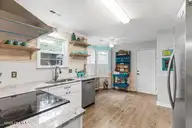 124 NE 15th Street, Oak Island, NC 28465 — 3-bedroom home in Long Beach, Oak Island, NC, photo 8 of 51: thumbnail-0196a7bd-040d-7078-ad13-073c4d