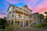 1417 N Topsail Drive, Surf City, NC 28445 — 4-bedroom waterfront home in Del Mar Beach, Surf City, NC, photo 1 of 56: 1-web-or-mls-Virtual Dusk_2