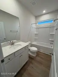 4151 Balboa Avenue, Leland, NC 28451 — 3-bedroom home in Pinewood, Leland, NC, photo 4 of 36: Hall bathroom