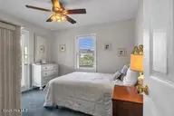 6707 Kings Lynn Drive, Oak Island, NC 28465 — 3-bedroom waterfront home in Kings Lynn, Oak Island, NC, photo 15 of 51: bed 2