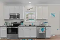 101 SW 28th Street, Oak Island, NC 28465 — 5-bedroom home in Pinners Point, Oak Island, NC, photo 19 of 56: Kitchen