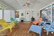 3215 Herthwood Place SW, Supply, NC 28462 — 3-bedroom waterfront manufactured home in West Tanglewood, Supply, NC, photo 17 of 36: Screened in back porch