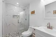 347 E First Street, Ocean Isle Beach, NC 28469 — 4-bedroom waterfront home, Ocean Isle Beach, NC, photo 20 of 49: Bathroom off bedroom
