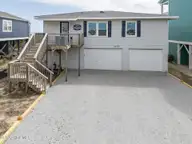 1001 Ocean Boulevard W, Holden Beach, NC 28462 — 3-bedroom waterfront home in Colonial Beach, Holden Beach, NC, photo 2 of 37: DJI_20260313154136_0141_D-HDR