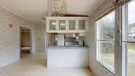 4100 Masonboro Loop Road, Wilmington, NC 28409 — 3-bedroom manufactured home in Navaho Woods, Wilmington, NC, photo 7 of 25: 4100-Masonboro-Loop-Rd-03252026_203921