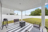 1080 Ben Thomas Drive NE, Leland, NC 28451 — 4-bedroom home in Coastal Haven, Leland, NC, photo 19 of 45: Covered Patio (4)