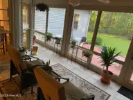506 Pamlico River Drive, Washington, NC 27889 — 3-bedroom waterfront home in Pamlico Plantation, Washington, NC, photo 12 of 24: Screened Porch