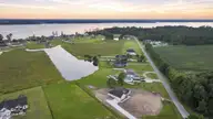 446 Pointe Vista Drive, Elizabeth City, NC 27909 — 4-bedroom waterfront home in The Waters At Sunset Pointe, Elizabeth City, NC, photo 7 of 47: 001_DJI_20260824171531_0506_D_007