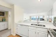 331 Salter Path Road 311, Pine Knoll Shores, NC 28512 — 3-bedroom waterfront condo in Beachwalk, Pine Knoll Shores, NC, photo 14 of 55: Open kitchen