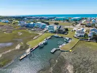 1711 E Fort Macon Road, Atlantic Beach, NC 28512 — 4-bedroom waterfront home in Asbury Beach, Atlantic Beach, NC, photo 13 of 42: Canal back yard