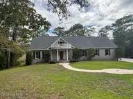 6465 Walden Pond Lane, Southport, NC 28461 — 3-bedroom waterfront home in Winding Creek, Southport, NC, photo 1 of 47