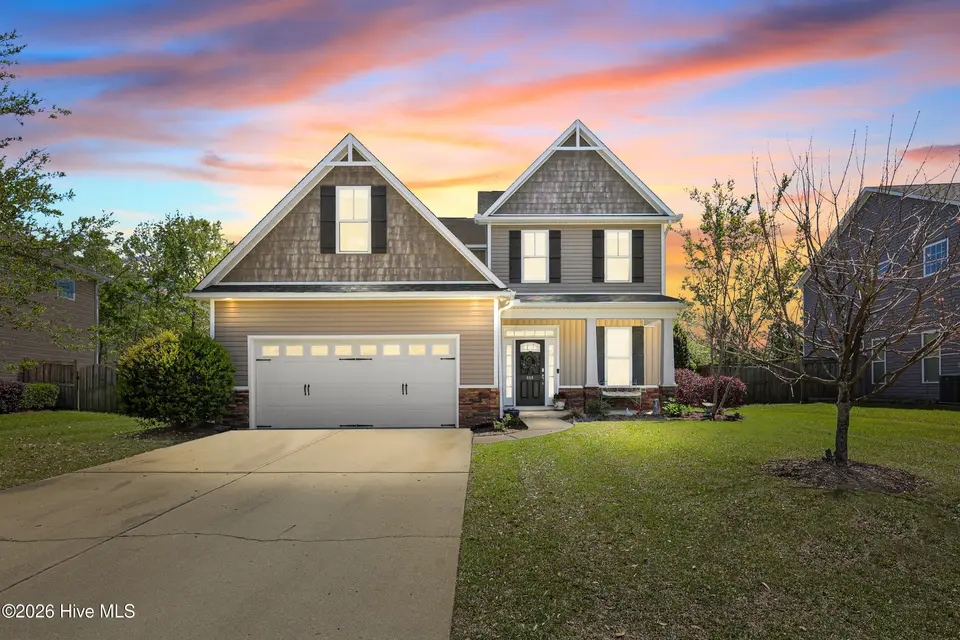 668 Heartwood Drive, Leland, NC 28479 — 4-bedroom home in Mallory Creek Plantation, Leland, NC, photo 1 of 63: Front of house