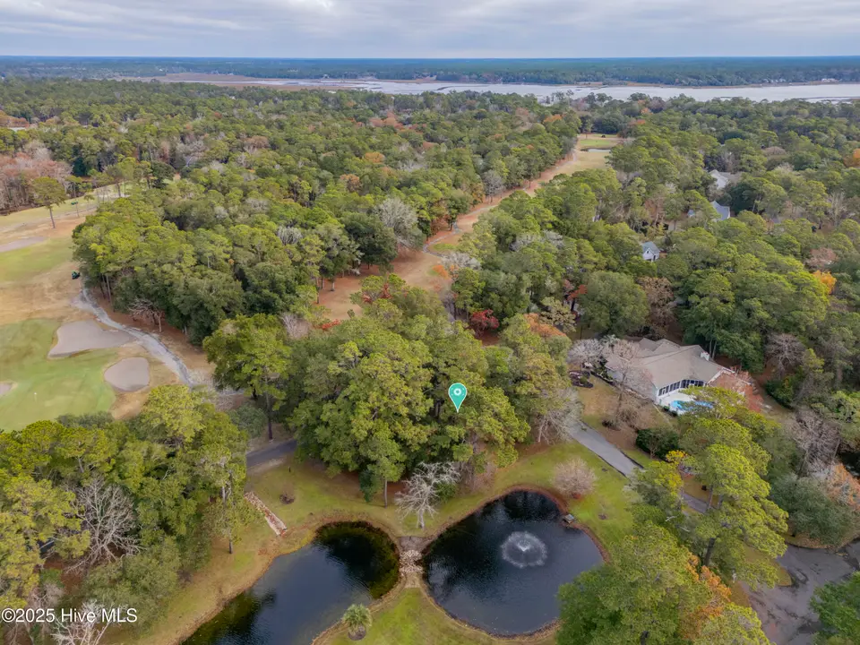 187 69 Clubhouse Drive SW, Supply, NC 28462 — waterfront lot in Lockwood Folly, Supply, NC, photo 1 of 27: DJI_0080_1