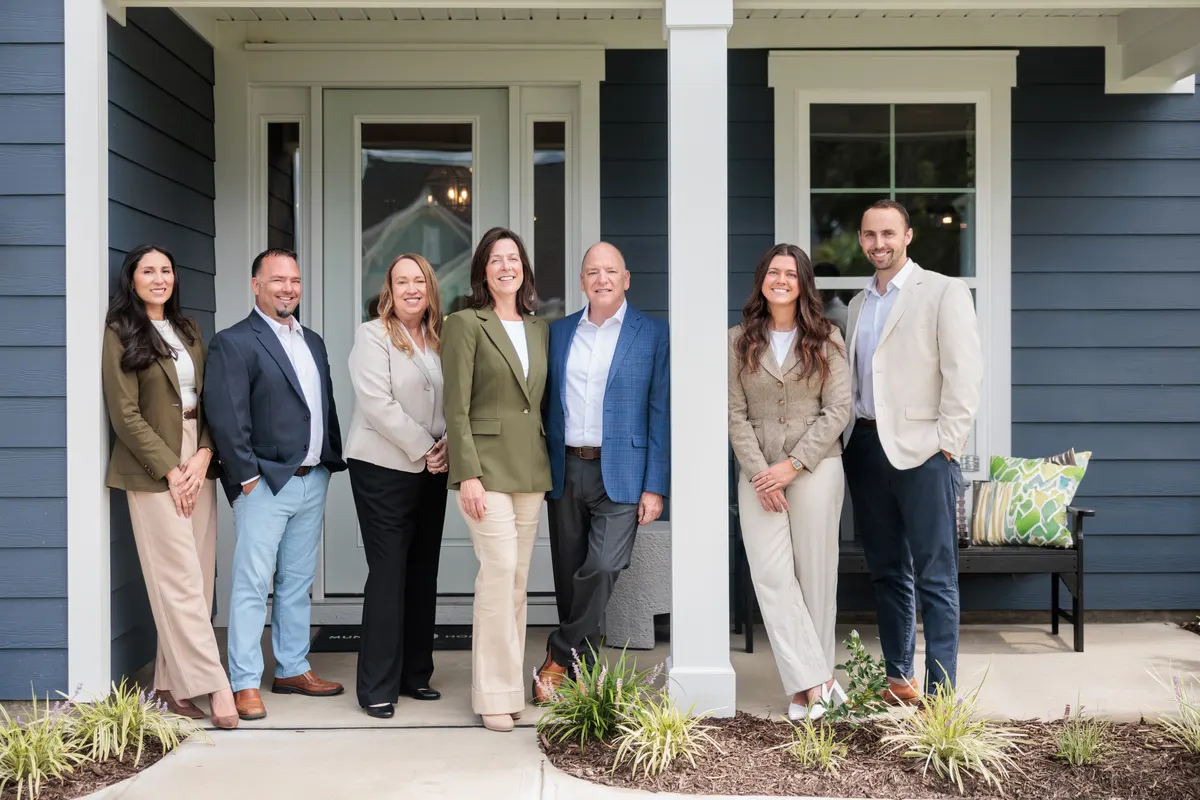 The Buddy Blake Team on a front porch in Wilmington, NC