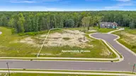 131 W Scarborough Court, Hampstead, NC 28443 — 5-bedroom waterfront home in Pecan Grove Plantation, Hampstead, NC, photo 3 of 28: 22-DJI_20250806005425_0060_D-Edit