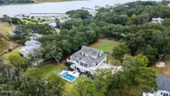 233 Chimney Lane, Wilmington, NC 28409 — 4-bedroom waterfront home in Old Chimney, Wilmington, NC, photo 1 of 69: 117-web-or-mls-GI - 233 Chimney Ln - Lis