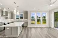 52 Pier View Court, Hampstead, NC 28443 — 4-bedroom waterfront home, Hampstead, NC, photo 4 of 60: 31_kitchen & living area