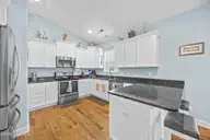 128 NE 8th Street, Oak Island, NC 28465 — 3-bedroom home, Oak Island, NC, photo 14 of 55: 16_kitchen