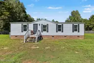 297 Mallard Roost Drive, Burgaw, NC 28425 — 3-bedroom manufactured home in Mallard Roost, Burgaw, NC, photo 1 of 22: Front door