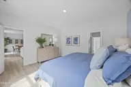 407 Loggerhead Boulevard, Surf City, NC 28445 — 3-bedroom home in Turtle Creek, Surf City, NC, photo 11 of 19: Pebble Primary Bedroom 2