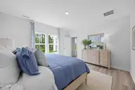 407 Loggerhead Boulevard, Surf City, NC 28445 — 3-bedroom home in Turtle Creek, Surf City, NC, photo 12 of 19: Pebble Primary Bedroom