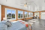 6075 6th Street, Surf City, NC 28445 — 3-bedroom waterfront home in Old Settlers Beach, Surf City, NC, photo 21 of 62: SUNROOM with Cypress Walls