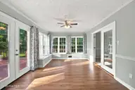 6207 Gondolier Drive, New Bern, NC 28560 — 3-bedroom waterfront home in Fairfield Harbour, New Bern, NC, photo 12 of 49: Sunroom