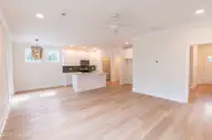 416 Timberwind Lane SE, Leland, NC 28451 — 3-bedroom waterfront home in Cypress Bay, Leland, NC, photo 12 of 32: 416-Timberwind-LN-SE-LIVING-ROOM-2-WEB