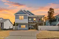 128 NE 8th Street, Oak Island, NC 28465 — 3-bedroom home, Oak Island, NC, photo 1 of 55: 1_virtual twilight