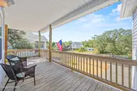 128 NE 8th Street, Oak Island, NC 28465 — 3-bedroom home, Oak Island, NC, photo 7 of 55: 9_porch