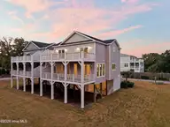 52 Pier View Court, Hampstead, NC 28443 — 4-bedroom waterfront home, Hampstead, NC, photo 9 of 60: 7_back right exterior sunset
