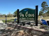324 The Cove Lane NE, Leland, NC 28451 — waterfront lot in The Cove at Town Creek, Leland, NC, photo 11 of 14: IMG_1746