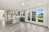 52 Pier View Court, Hampstead, NC 28443 — 4-bedroom waterfront home, Hampstead, NC, photo 24 of 60: 34_hallway, kitchen & living area